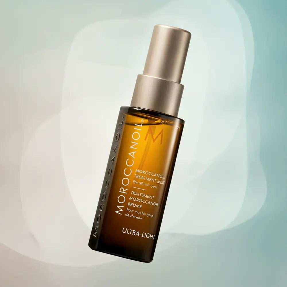 Perfume Moroccanoil Treatment Mist Ultra-Light Spray Capilar - Moroccanoil em composição atmosférica com iluminação sofisticada